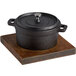 a black cast iron pot with a lid