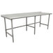 A stainless steel Advance Tabco work table with an open base.