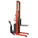 A red and black Wesco Industrial Products Power Lift Fork Stacker with 25" forks.