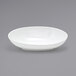 a white bowl on a gray background