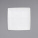 a white square plate on a gray background