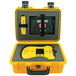 A yellow Defibtech Shok Box case with a device in it.