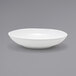 a white bowl on a gray background