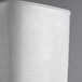 A white square Carlisle food storage container with a lid.