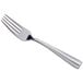 An Acopa stainless steel dinner fork with a silver handle.