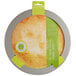A round metal Fox Run pie crust shield with a round label.