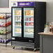 An Avantco black swing glass door merchandiser freezer with LED lighting.