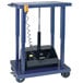 A blue Wesco tilt table lift with a black box on it.