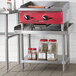 A Regency stainless steel equipment stand with a stainless steel shelf.