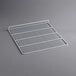 A white metal grid shelf for an Avantco Deli Case.