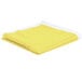 A yellow Intedge vinyl table cover with flannel back folded up on a white background.