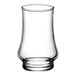 An Arcoroc Kenzie whiskey taster glass with a small amount of liquid in it.