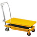 A yellow Wesco Industrial Products double scissors high lift table with wheels.