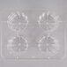 A clear plastic tray with four circular compartments.