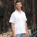 A man in a white Uncommon Chef cook shirt.