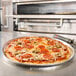 A Rich's par-baked thin pizza on a metal tray in a kitchen.