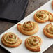 A plate with several Fiera Foods puff pastries on it.