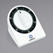 A close-up of a Comark mechanical kitchen timer with a white background and black numbers.