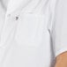 A person wearing a white Uncommon Chef cook shirt.