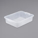 A white plastic Vollrath Traex food storage box with a lid on a gray surface.