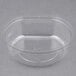 A clear Fabri-Kal plastic parfait insert with a lid.