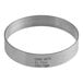 A silver circular stainless steel Fat Daddio's round tart ring with writing on it.