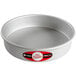 A round silver Fat Daddio's cake pan with a red and white label.