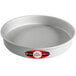 A round silver metal cake pan with a red and black label.