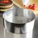 a silver bowl on a counter