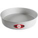 A round silver Fat Daddio's cake pan with a red and white label.