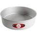 A round silver Fat Daddio's cake pan with a red and white logo.