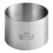 A stainless steel round cake/food ring mold with a logo on it.
