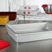 A Fat Daddio's rectangular anodized aluminum cake pan on a counter.