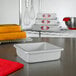 A Fat Daddio's square anodized aluminum cake pan on a counter.