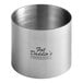 A silver stainless steel round cake/food ring mold with a logo on it.
