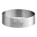 A close-up of a stainless steel Fat Daddio's round tartlet ring.