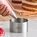 A stainless steel round cake and food ring mold with 'Fat Daddio's ProSeries' branding.