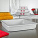 A white rectangular Fat Daddio's cake pan on a counter.