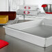 A Fat Daddio's rectangular cake pan on a counter.