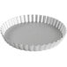 A round silver pan with a scalloped edge.