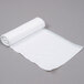 A roll of white plastic trash bags.