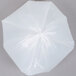A close-up of a white Berry low density plastic trash bag.