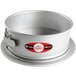 A round silver Fat Daddio's anodized aluminum springform cake pan.