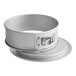 A white round metal Fat Daddio's springform cake pan.