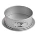 A round metal Fat Daddio's springform cake pan with a handle.