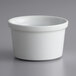 A close up of a bright white Corona porcelain ramekin.