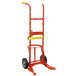 A red hand truck with yellow handles.