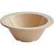 A tan melamine bowl with a white rim.