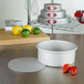 A Fat Daddio's round cheesecake pan with a removable bottom on a counter.