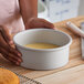 A round, straight-sided 7-inch cheesecake pan with a removable bottom, made of anodized aluminum.